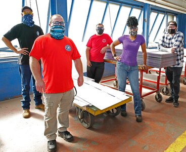 Norfolk Naval Shipyard’s Nuclear Sheetmetal Shop (Shop 17) has installed over 6,000 feet of personnel guards to aid in the fight against COVID-19. The team spearheading this effort is composed of Sheetmetal Mechanics Matt Legg, Thomas Deller, Brian Nipper, Steven Myers, and Monica Cooper.