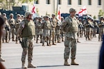 Georgian Defense Forces Col. Irodi Kadagishvili, deputy commander of East Command, and Georgia Army National Guard Col. Jason Fryman, U.S. exercise director of Noble Partner 20, participate in the opening ceremony at Vaziani Training Area, Georgia, Sept. 7, 2020. The Georgia National Guard and the country of Georgia have participated in the U.S. Army National Guard State Partnership Program for 26 years, ensuring interoperability, functionality, and regional stability.