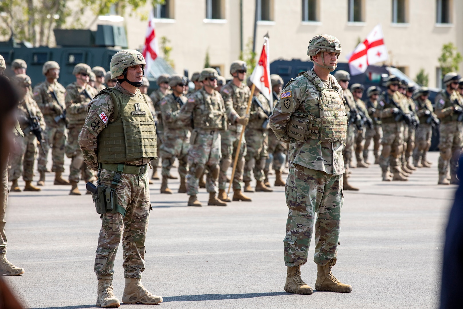 Georgian Defense Forces Col. Irodi Kadagishvili, deputy commander of East Command, and Georgia Army National Guard Col. Jason Fryman, U.S. exercise director of Noble Partner 20, participate in the opening ceremony at Vaziani Training Area, Georgia, Sept. 7, 2020. The Georgia National Guard and the country of Georgia have participated in the U.S. Army National Guard State Partnership Program for 26 years, ensuring interoperability, functionality, and regional stability.