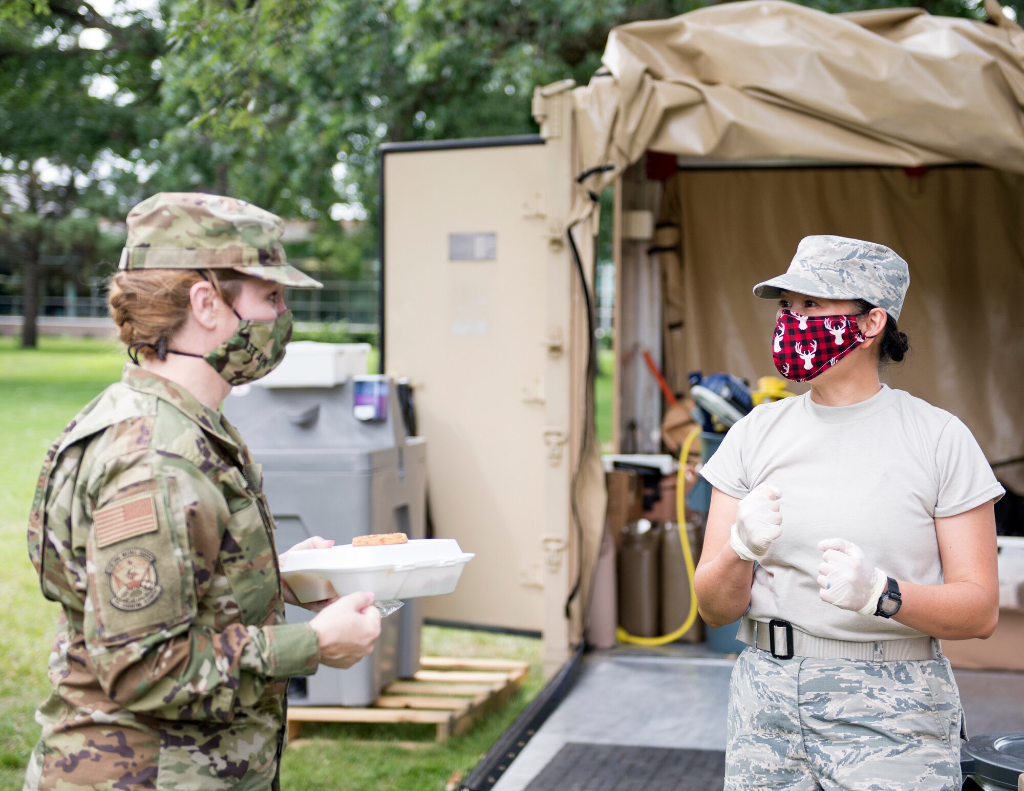U.S. Air Force Senior Airman Daisy Johnson, 133rd Sustainment Services Flight, takes an Airman’s drink order in St. Paul, Minn., Aug. 20, 2020.