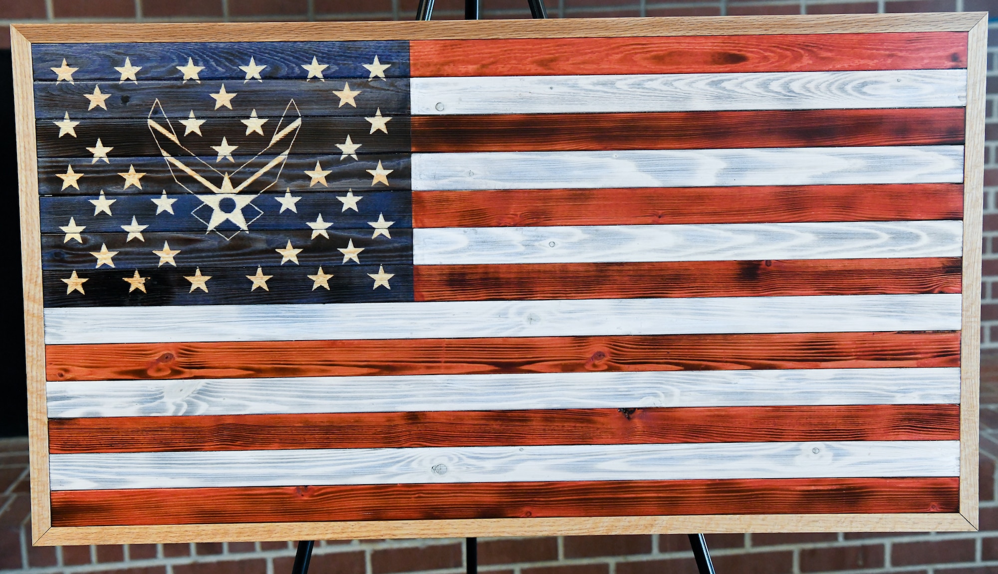 Brandon Champion, an Arnold Engineering Development Complex instrumentation technician, gifted to the Air Force an artistic representation of a flag he made, Aug. 7, 2020, at Arnold Lakeside Center at Arnold Air Force Base, Tenn. (U.S. Air Force photo by Jill Pickett)