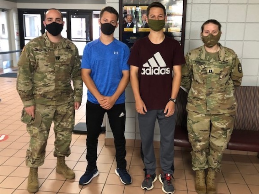 Left to Right: Capt. Alec Fritz, Joshua and Caleb Pym, and Capt. Rachel Stafford at Natcher Gymnasium at Fort Knox, Ky., prior to the CFA.