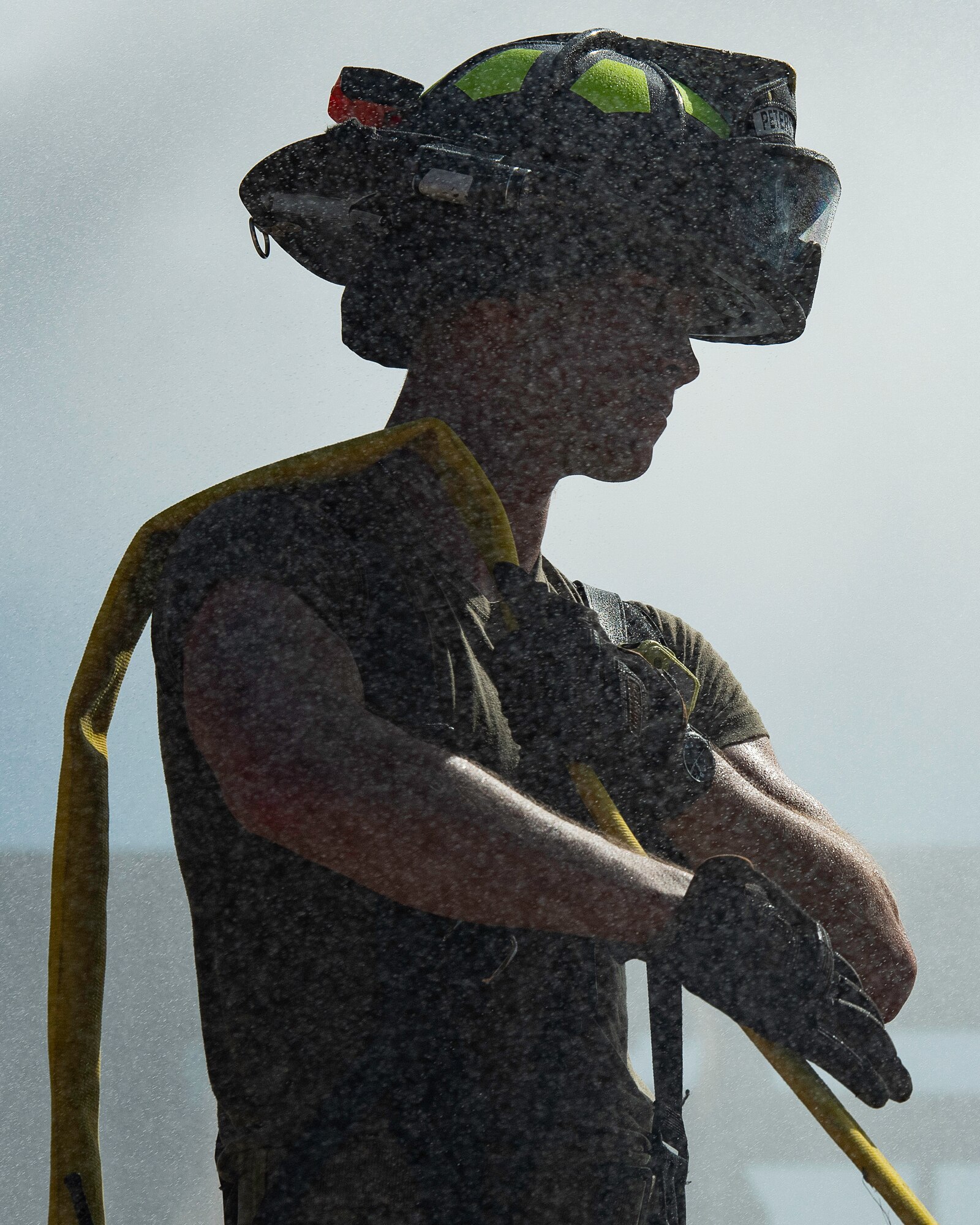 Picture of Airman holding fire hose