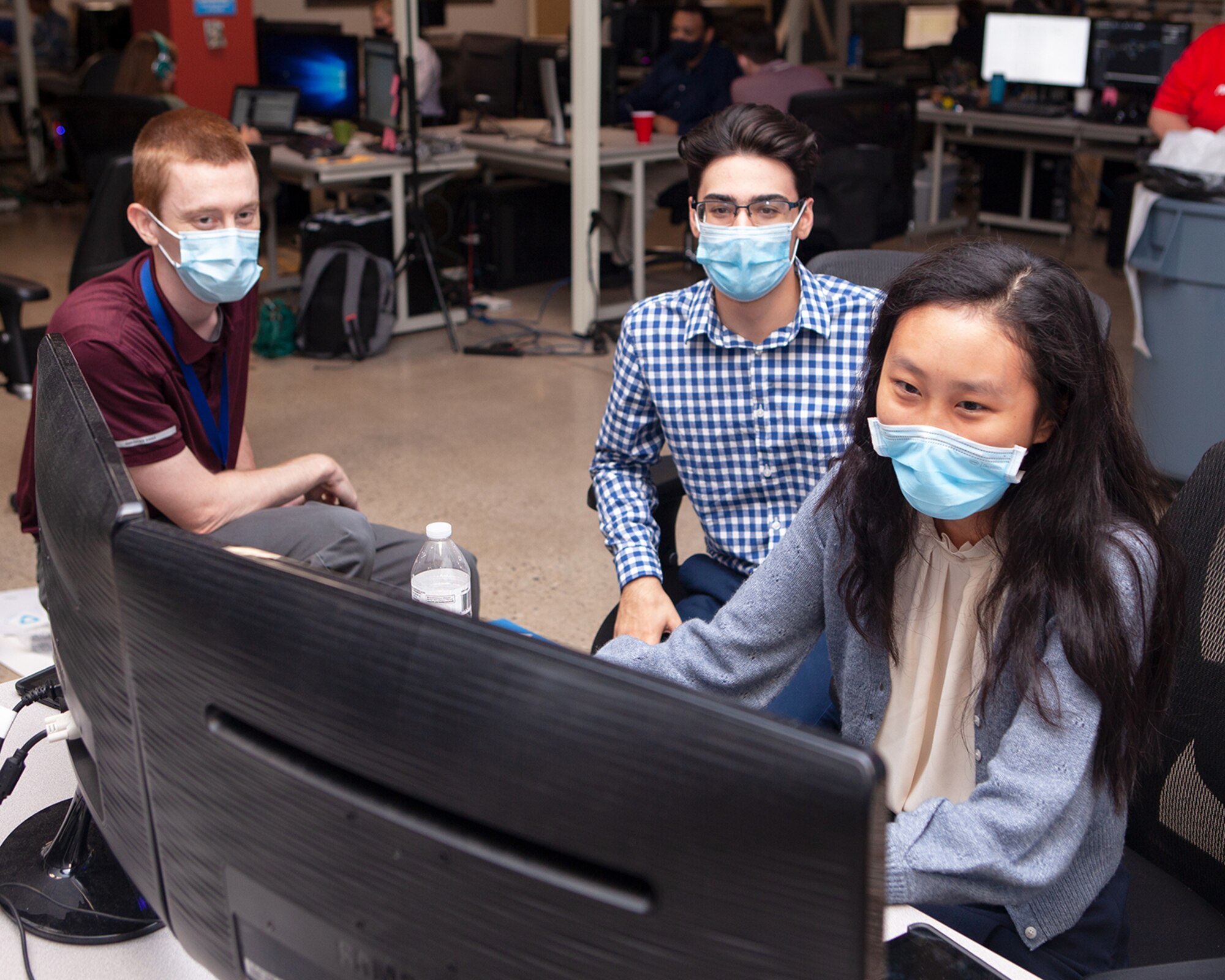 A small group of students doing modeling and simulation project work at the GRILL (Gaming Research Integration for Learning Lab). (Courtesy photo)
