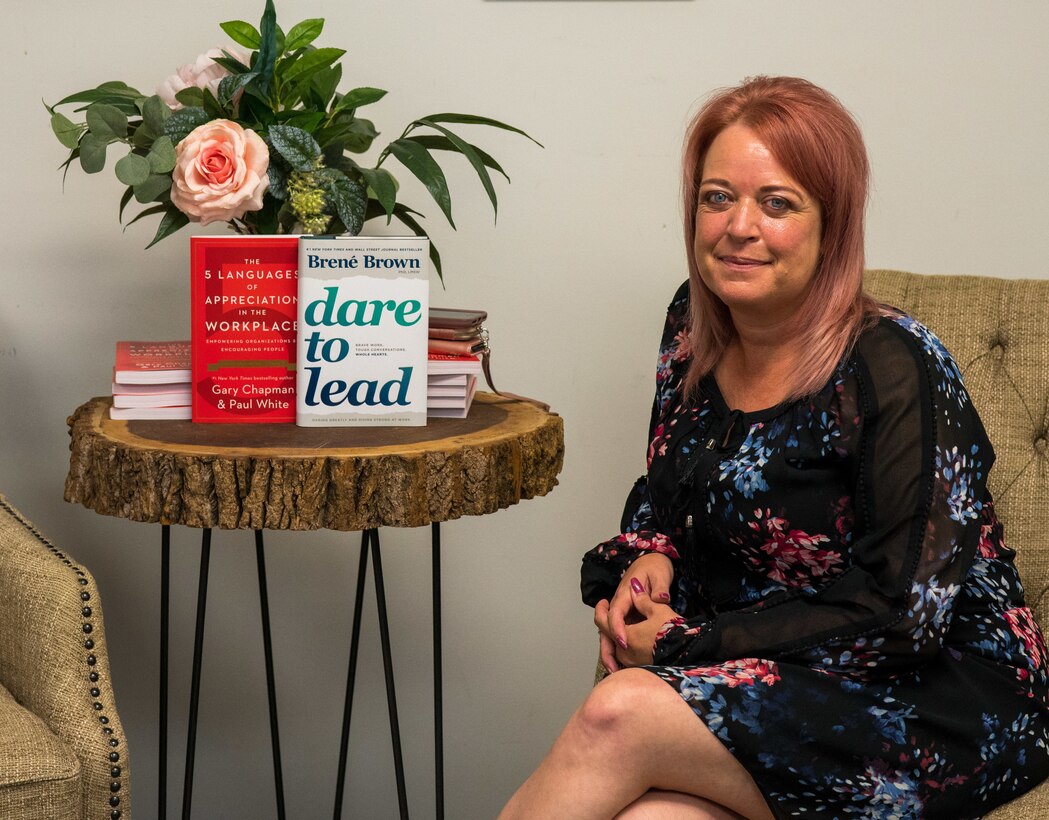 Ms. Tania Wiggins, the violence prevention integrator for Keesler Air Force Base, Miss., poses for a photo in her office at the 81st Training Wing building July 14, 2020. Wiggins is part of the Air Force's sole violence prevention-based initiative, working to use data to train Airmen and lessen the number of interpersonal and self-directed incidences of violence. (U.S. Air Force photo by Senior Airman Kristen Pittman)
