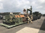 Soldiers assigned to the 563rd Medical Logistics Company's forward logistics element load field sets prior to executing convoy operations during a field training exercise, held Aug. 15-22 in South Korea.