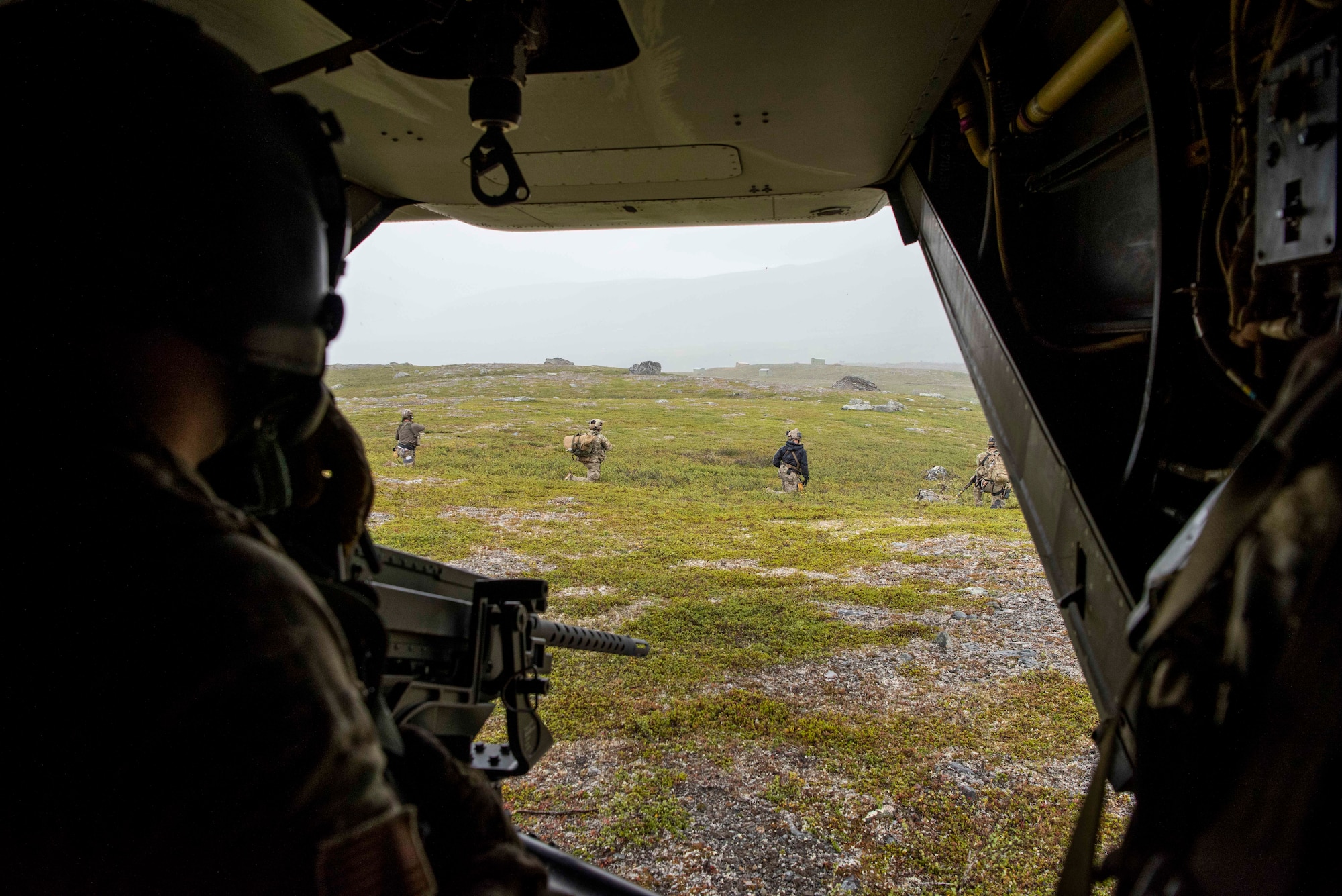 A 7th Special Operations Squadron Airman provides security for 321st Special Tactics Squadron opera-tors as they secure a CV-22 Osprey, based out of RAF Mildenhall, U.K., landing site during a training mission near Bodø, Norway, August 27, 2020. Integration with the Norwegian Air Force allowed the 352d Special Operations Wing to enhance and strengthen bonds with our partner nation and further se-cure the strategic high-north region. The exercise provided training for 352d Special Operations Wing members on capabilities such as personnel recovery, forward area refueling point, aerial refueling, mari-time craft delivery system, and fast rope training. (U.S. Air Force photo by Staff Sgt. Michael Wash-burn)