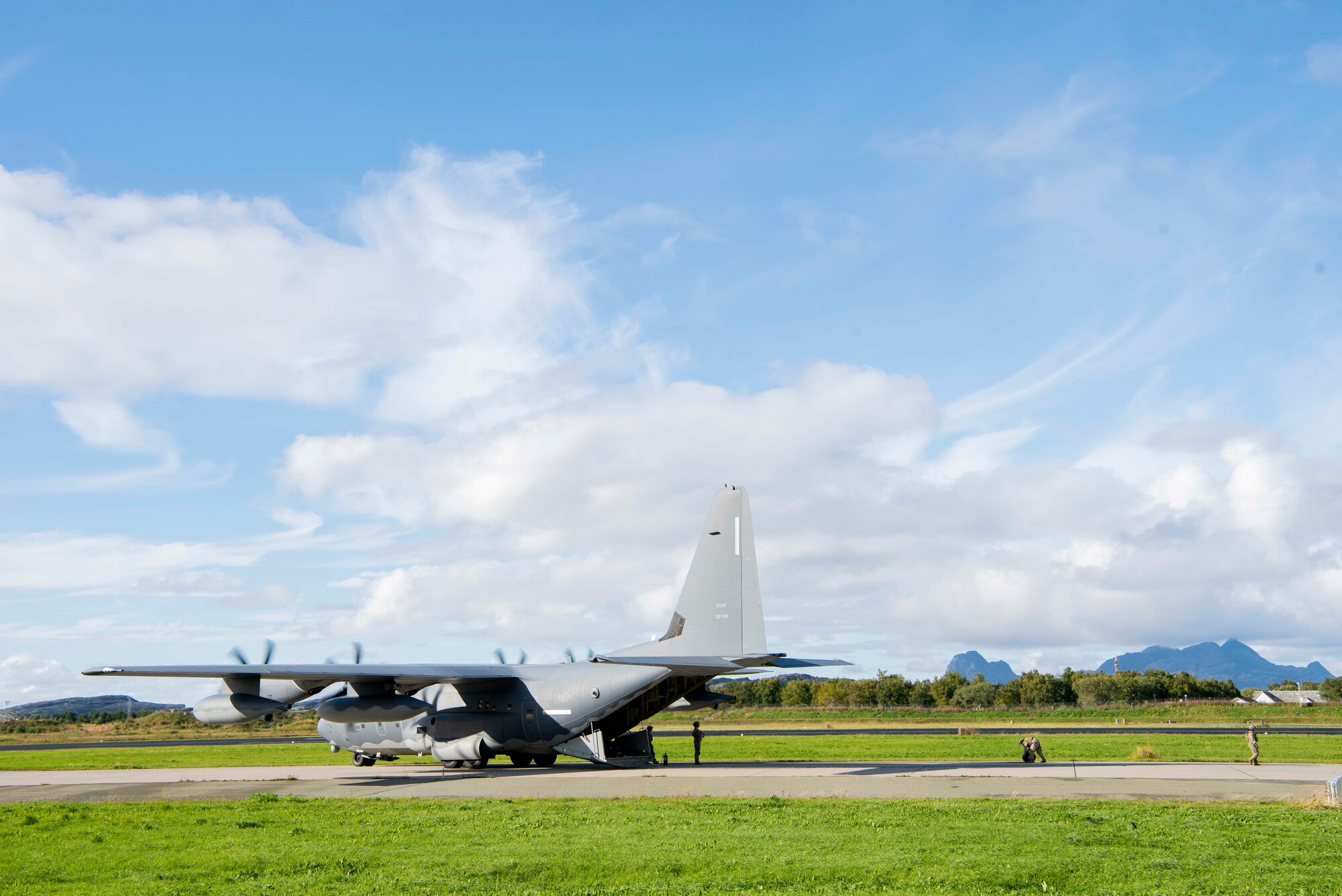 A forward area refueling point specialist with the 100th Logistics Readiness Squadron, rolls up a fuel hose after refueling a Royal Norwegian Air Force F-16 Fighting Falcon during a training exercise at Rygge Air Station, Norway, August 26, 2020. Integration with the Norwegian Air Force allowed the 352d Special Operations Wing to enhance and strengthen bonds with our partner nation and further se-cure the strategic high-north region. The exercise provided training for 352d Special Operations Wing members on capabilities such as personnel recovery, forward area refueling point, aerial refueling, mari-time craft delivery system, and fast rope training. (U.S. Air Force photo by Staff Sgt. Michael Wash-burn)