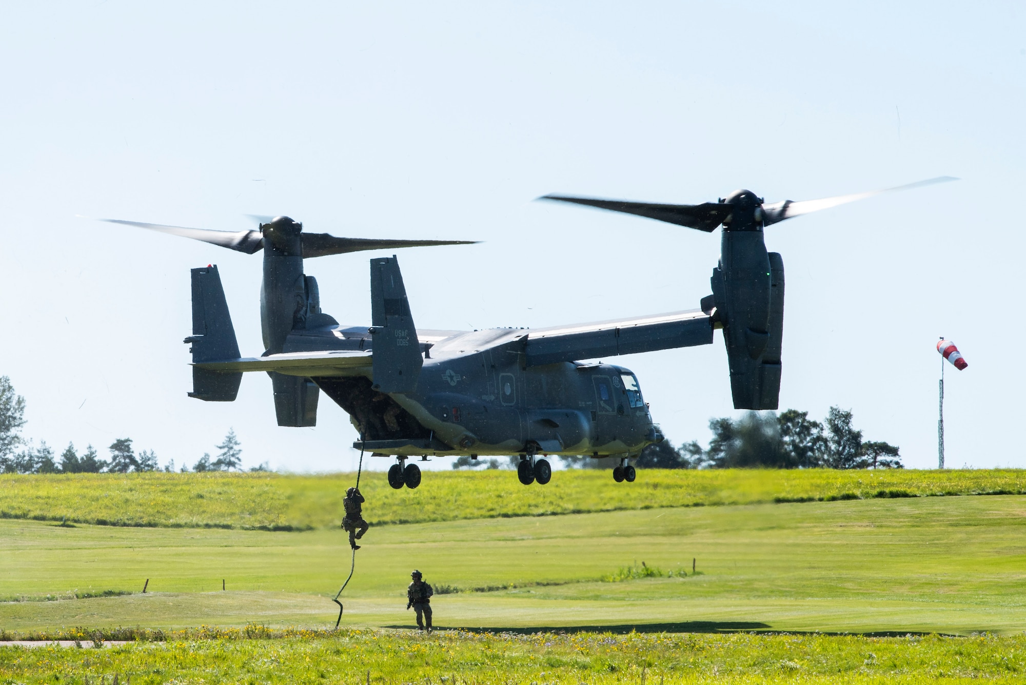 321st Special Tactics Squadron Airmen repel from a CV-22B Osprey, based out of RAF Mildenhall, U.K., during a training mission at Rygge Air Station, Norway, August 25, 2020. Integration with the Norwegian Air Force allowed the 352d Special Operations Wing to enhance and strengthen bonds with our partner nation and further secure the strategic high-north region. The exercise provided training for 352d Special Operations Wing members on capabilities such as personnel recovery, forward area refuel-ing point, aerial refueling, maritime craft delivery system, and fast rope training. (U.S. Air Force photo by Staff Sgt. Michael Washburn)