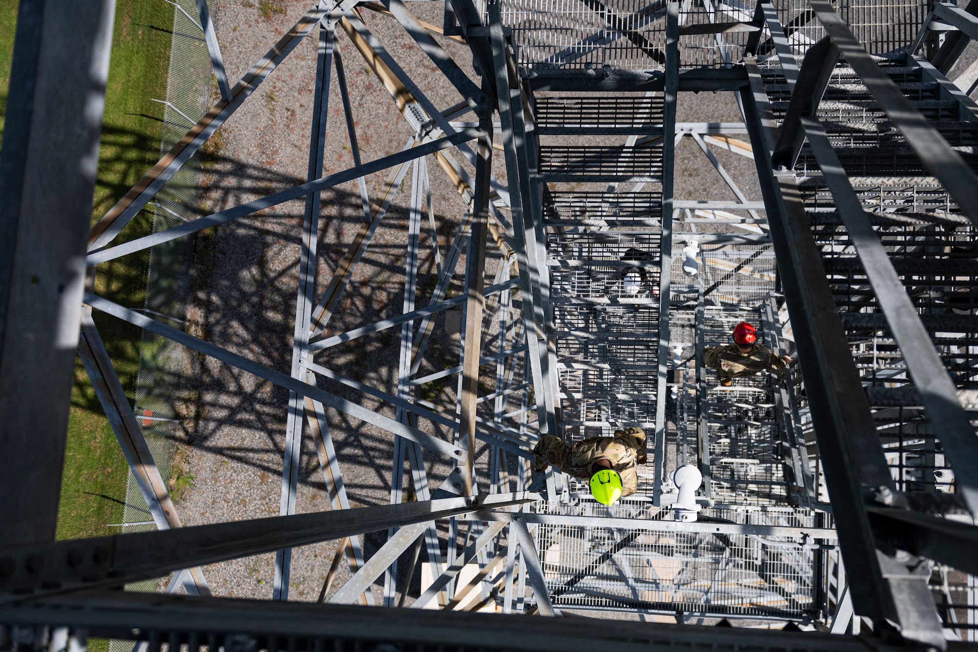 A photo of Airmen climbing down stairs