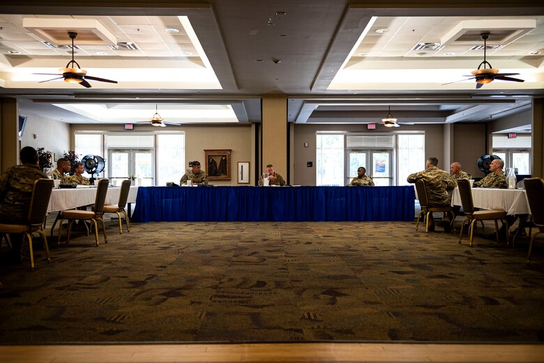 Photo of command chief speaking with Moody leadership.