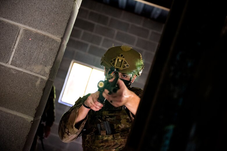 Photo of Airman demonstrating shooting techniques.