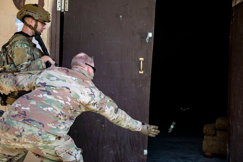 Photo of command chief throwing a flash-bang.