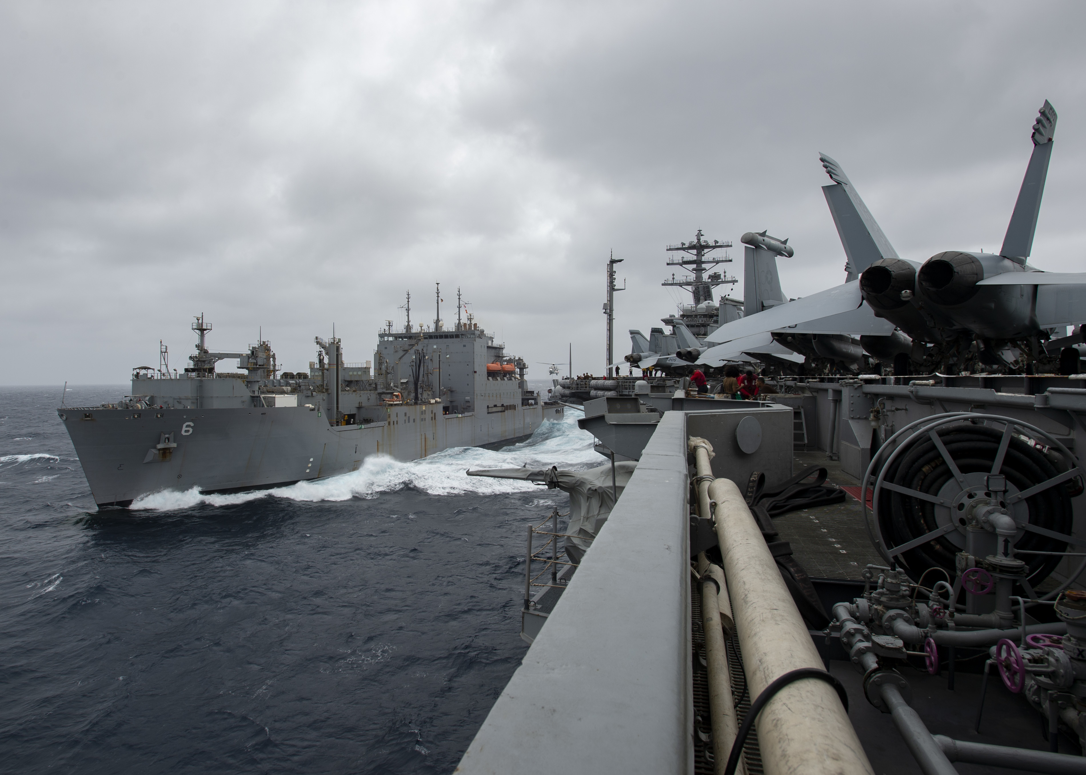 The aircraft carrier USS Nimitz (CVN 68) conducts a replenishment-at-sea with the Lewis and Clark-class dry cargo and ammunition ship USNS Amelia Earhart (T-AKE 6).