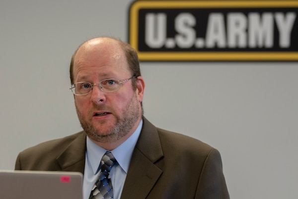 Richard Davis, Defense Finance and Accounting Service Indianapolis site deputy director, talks to a virtual audience during a virtual Theater Orientation Conference at the Maj. Gen. Emmett J. Bean Federal Center in Indianapolis Aug. 17. The purpose of the TOC is to prepare deploying finance and comptroller units by creating a forum for them to discuss issues with units currently deployed alongside USAFMCOM and the Defense Finance and Accounting Service. (U.S. Army photo by Mark R. W. Orders-Woempner)