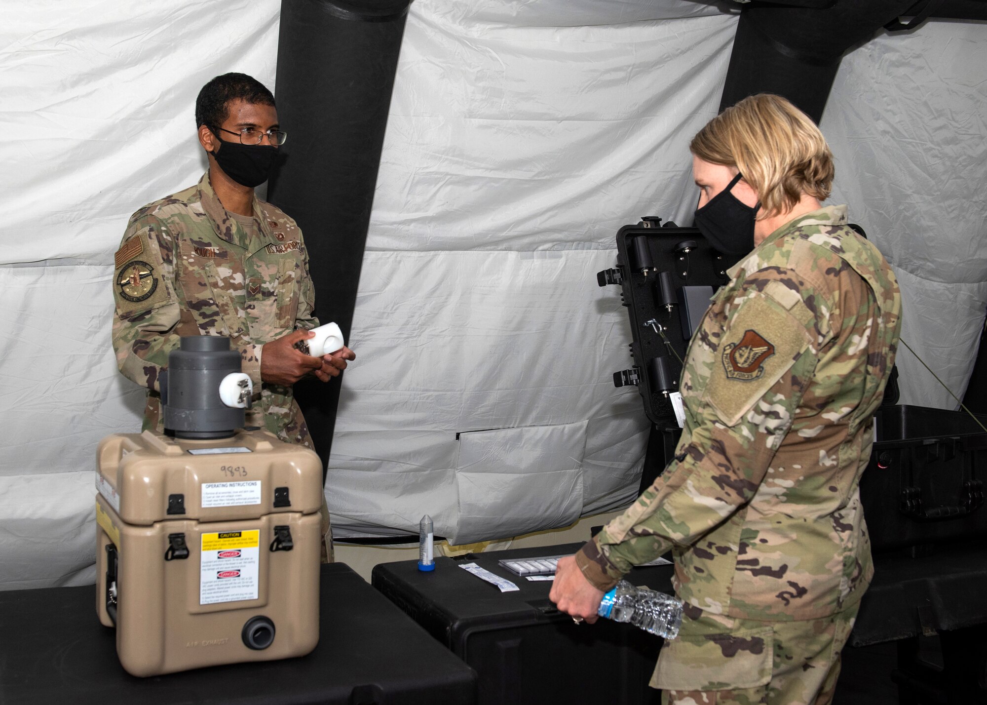 U.S. Air Force Senior Airman Micha Hough, a 773d Civil Engineer Squadron emergency management apprentice, briefs U.S. Air Force Col. Kirsten Aguilar, Joint Base Elmendorf-Richardson and 673d Air Base Wing commander, about emergency management equipment during a 773d CES immersion tour at JBER, Alaska, Sept. 1, 2020. Aguilar familiarized herself with the 773d CES and its role in supporting installation readiness after taking command of the installation on July 14, 2020. The 773d CES maintains structures throughout the base as well as runs the installation’s emergency management program.