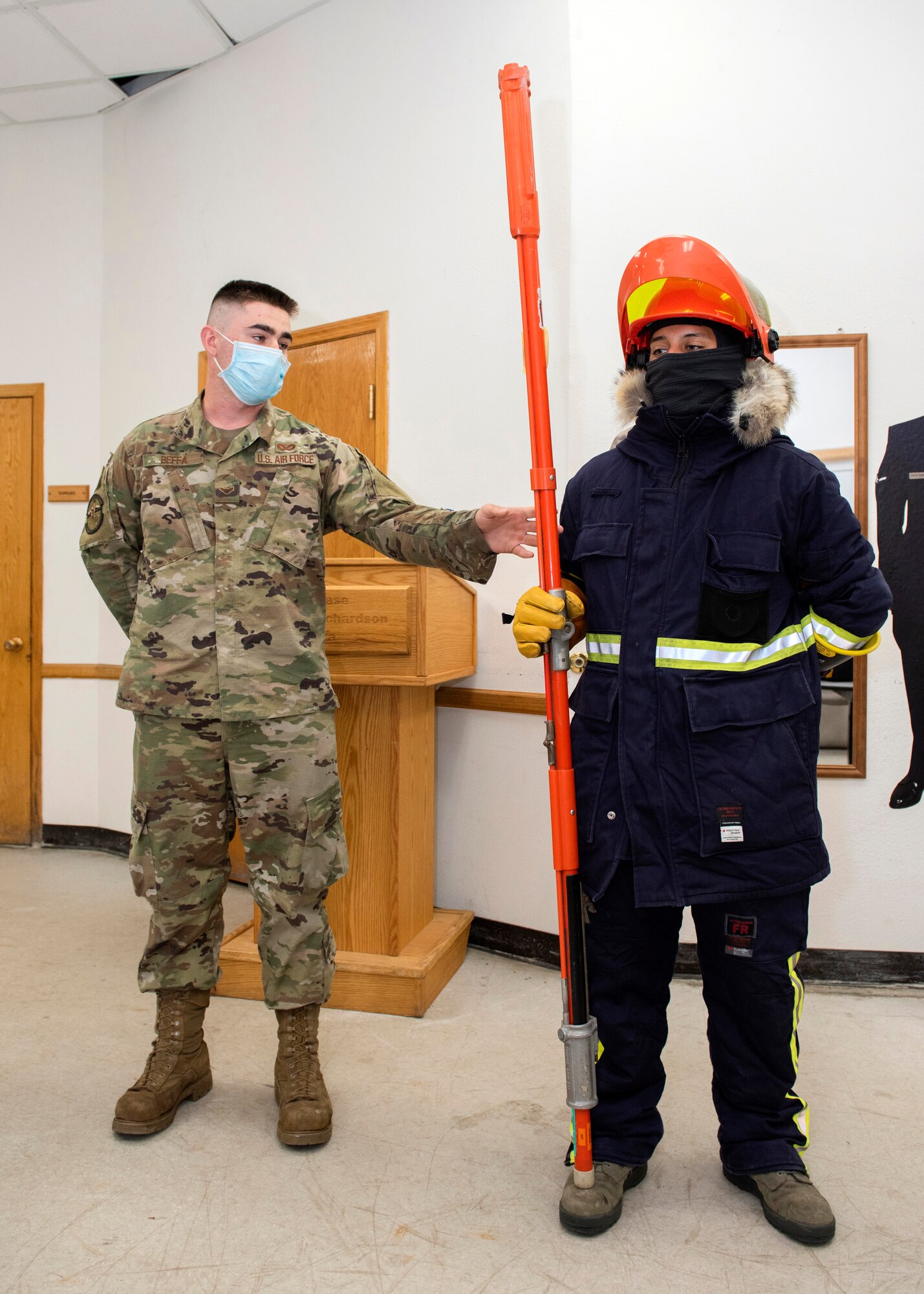 U.S. Air Force Airmen 1st Class Timothy Beffa and Jose Tapia-Borbon, both 773d Civil Engineer Squadron electric systems technicians, demonstrate their equipment during a 773d CES immersion tour at Joint Base Elmendorf-Richardson, Alaska, Sept. 1, 2020. Aguilar familiarized herself with the 773d CES and its role in supporting installation readiness after taking command of the installation on July 14, 2020. The 773d CES maintains structures throughout the base as well as runs the installation’s emergency management program.