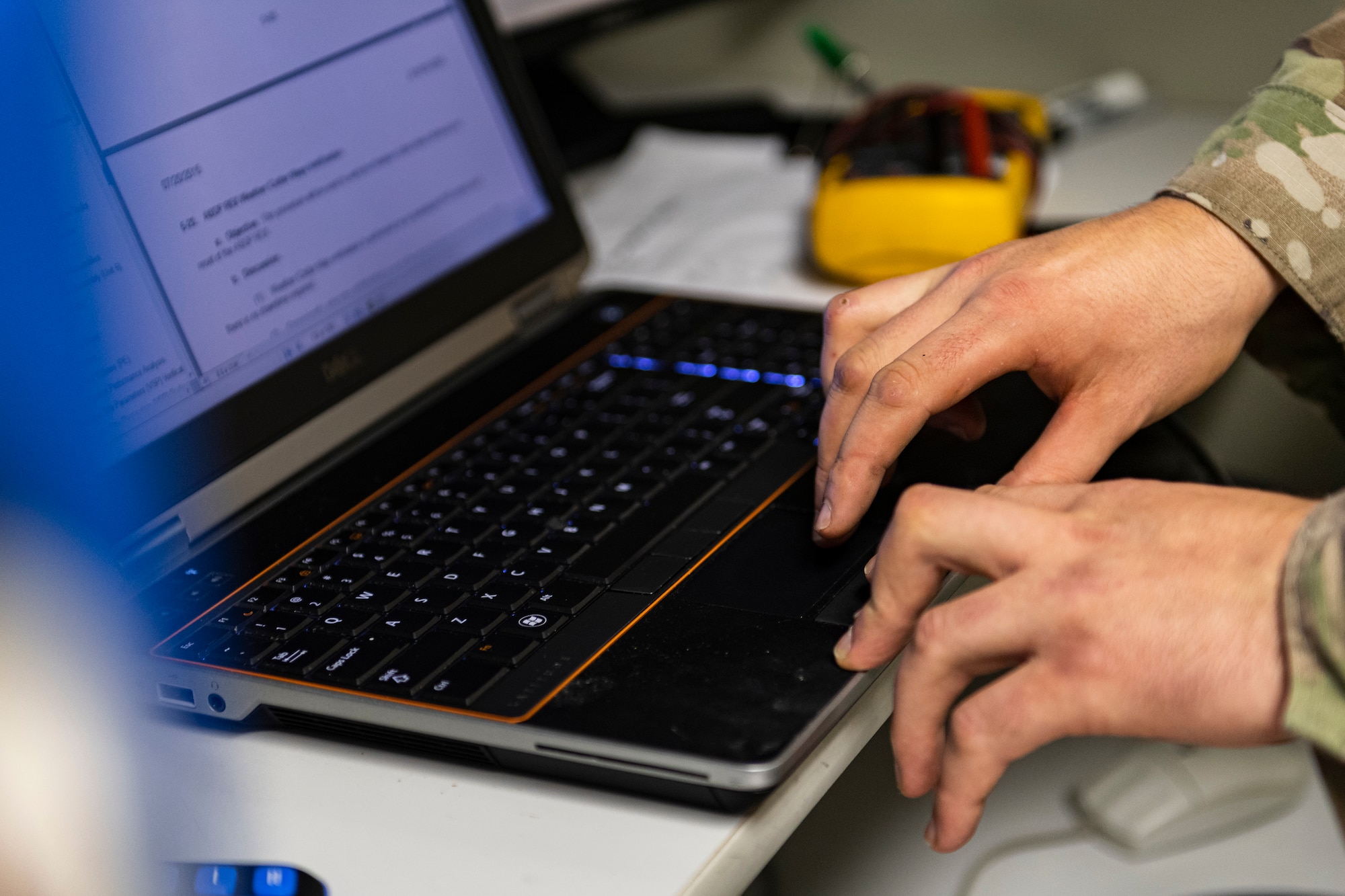 A photo of an Airman using a laptop