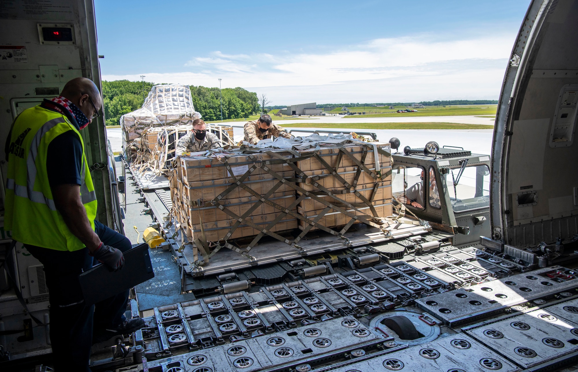 436th Aerial Port Squadron Airmen load cargo being delivered to Ukraine onto a contracted aircraft at Dover Air Force Base, Delaware, June 16, 2020. Contracted aircraft stopped at Dover AFB to pick up cargo as part of a foreign military sales project. The U.S. is committed to the sovereignty and territorial integrity of Ukraine. The two countries continue to strengthen their partnership first initiated in 1993. (U.S. Air Force photo by Senior Airman Christopher Quail)