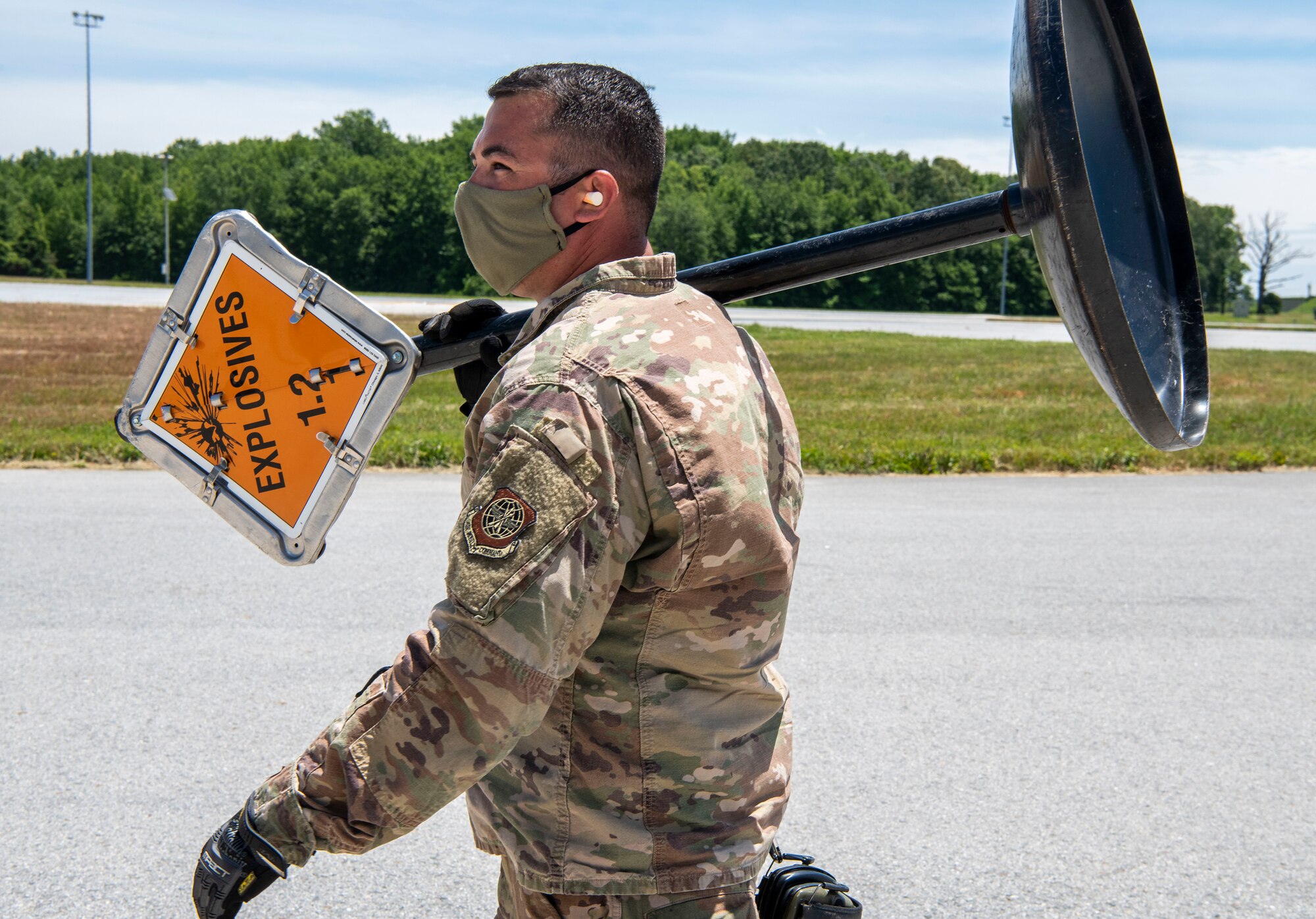 Staff Sgt. Justin Pruitt, 436th Aerial Port Squadron ramp operations supervisor, carries an explosives sign at Dover Air Force Base, Delaware, June 16, 2020. Contracted aircraft stopped at Dover AFB to pick up cargo as part of a foreign military sales project. The U.S. is committed to the sovereignty and territorial integrity of Ukraine. The two countries continue to strengthen their partnership first initiated in 1993. (U.S. Air Force photo by Senior Airman Christopher Quail)