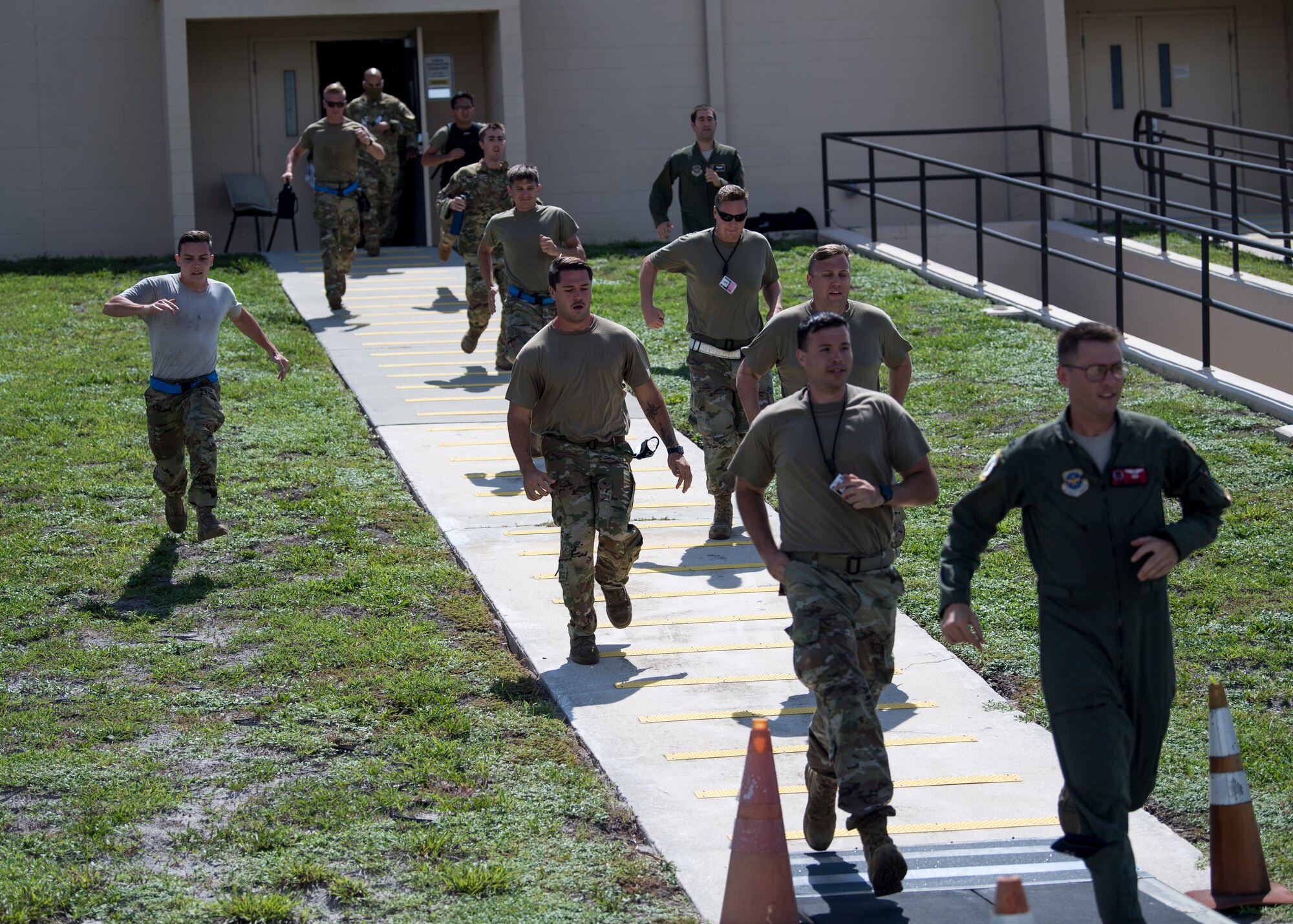 Members of Team MacDill sprint from the alert facility during a joint training exercise at MacDill Air Force Base, Fla., Aug. 29, 2020.