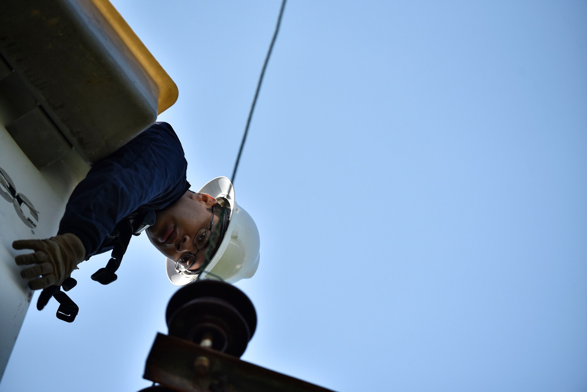 Senior Airman Keith Robinson, 8th Civil Engineer Squadron electrical systems technician, prepares to reconnect a line from a bucket truck during typhoon recovery operations at Kunsan Air Base, Republic of Korea, Sept. 3, 2020.