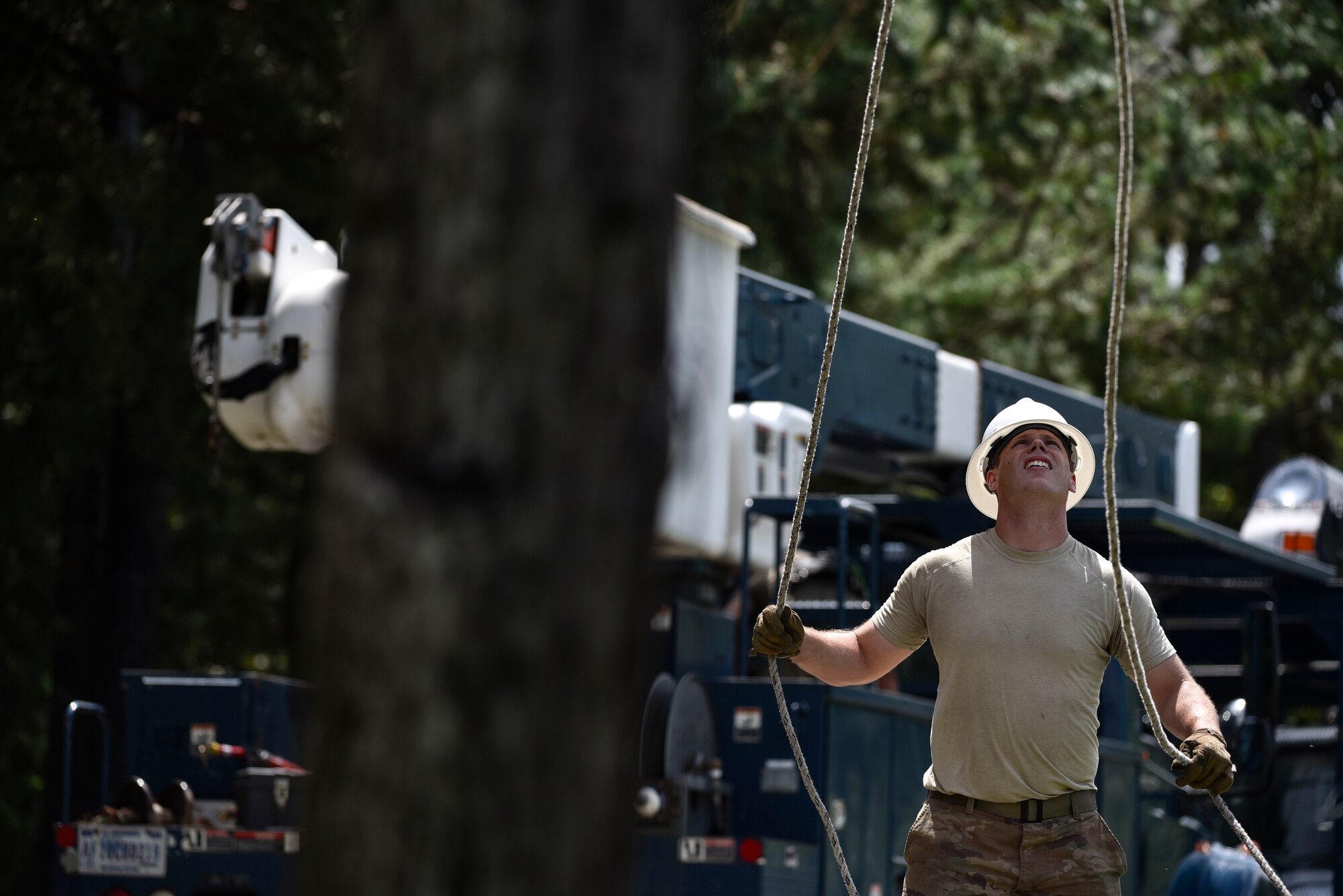 Staff Sgt. Mark Sylvester, 8th Civil Engineer Squadron electrical systems technician, prepares a line for reattachment during typhoon recovery operations at Kunsan Air Base, Republic of Korea, Sept. 3, 2020.