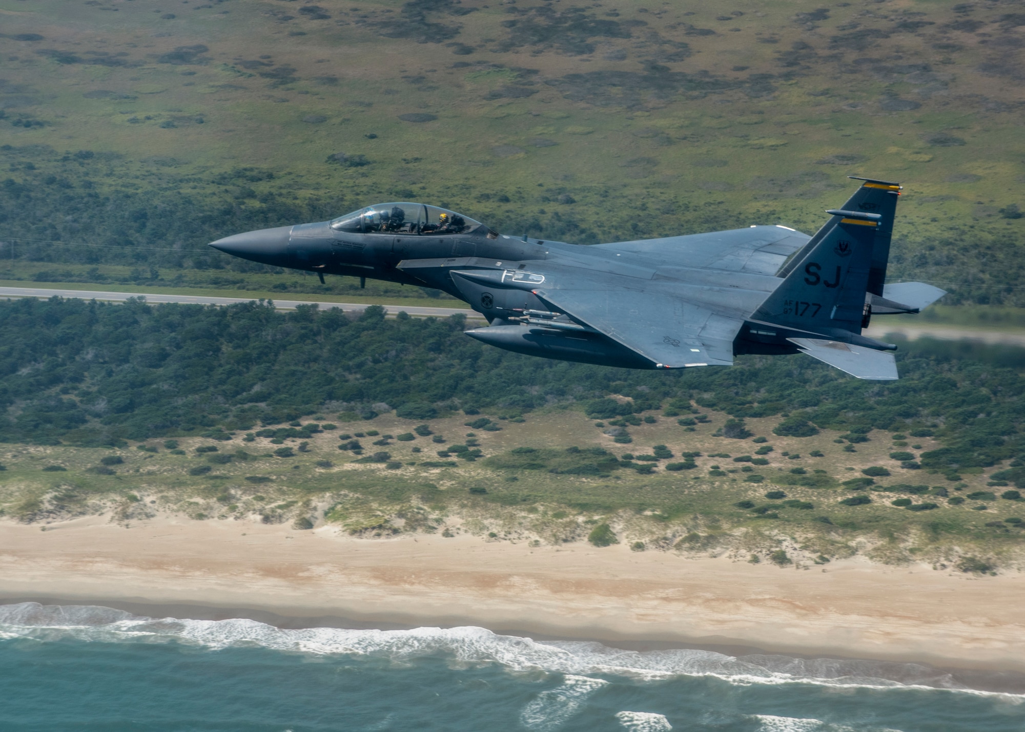An F-15E Strike Eagle from the 336th Fighter Squadron at Seymour Johnson Air Force Base flies in the sky over the North Carolina coast.