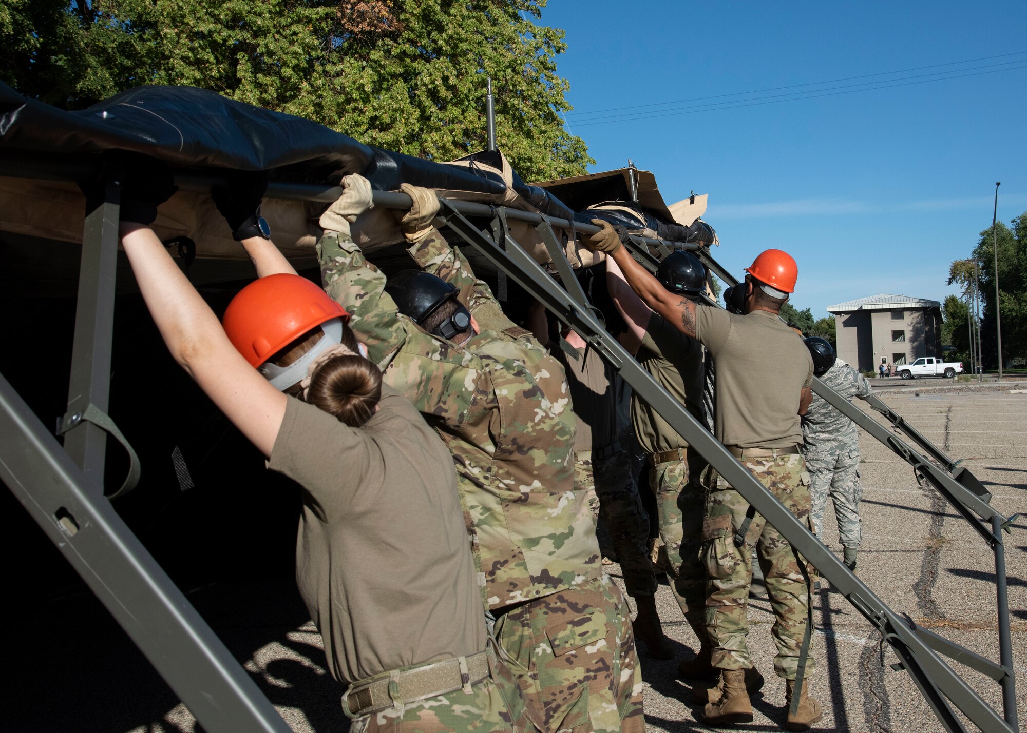 Airmen from the 366th Force Support Squadron set up a tent during a training exercise, Sept. 4, 2020, on Mountain Home Air Force Base, Idaho. The training is part of an annual pallet expeditionary kitchen set up exercise. (U.S. Air Force photo by Airman Andrea Rozoto)