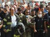 Soldiers, firefighters and policemen stand in front of ground zero in New York praying on Sept. 11, 2001, after terrorists crashed four commercial airliners into the World Trade Center towers, the Pentagon and a Pennsylvania field. A total of 2,996 people died, including the 19 terrorists.