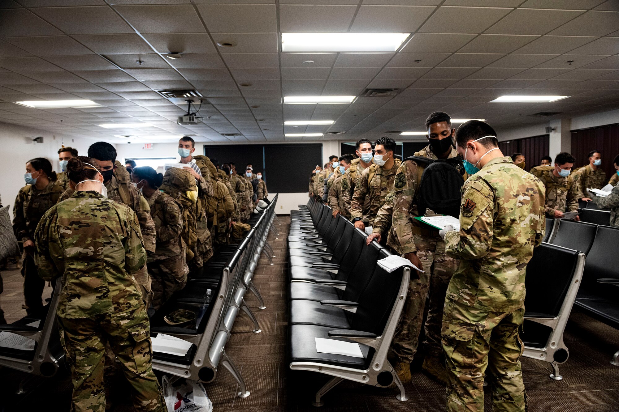 Photo of Airmen getting medically screened.