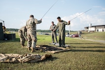 A photo of Airmen setting up equipment