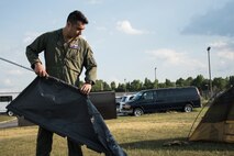 A photo of Airmen setting up equipment