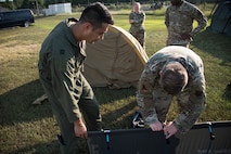 A photo of Airmen setting up equipment