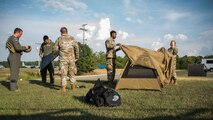A photo of Airmen setting up equipment