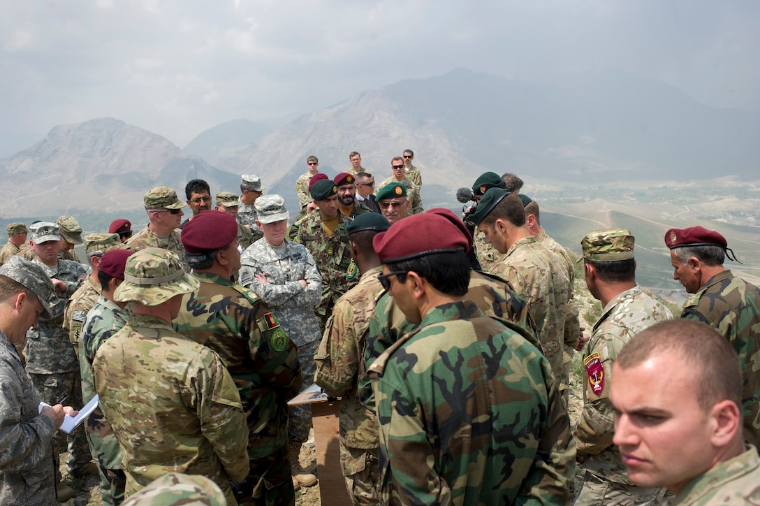 General Martin E. Dempsey, then Chairman of the Joint Chiefs of Staff, center, listens to briefing from U.S. and Afghan special operations forces at Camp Morehead, Afghanistan, April 23, 2012 (DOD/D. Myles Cullen)
