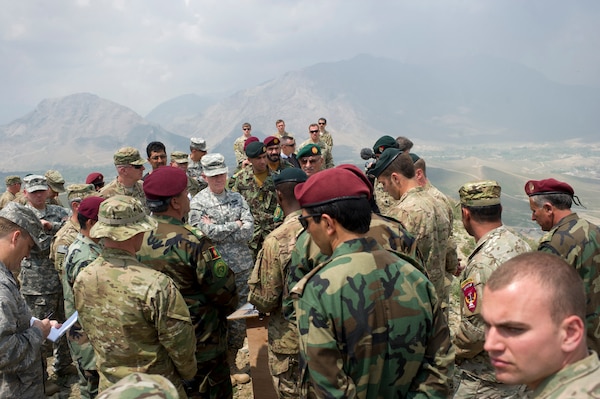 General Martin E. Dempsey, then Chairman of the Joint Chiefs of Staff, center, listens to briefing from U.S. and Afghan special operations forces at Camp Morehead, Afghanistan, April 23, 2012 (DOD/D. Myles Cullen)