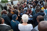 U.S. Ambassador to Liberia Deborah Malac, in white, and president of Liberia Ellen Johnson Sirleaf, left, speak to reporters after touring Ebola treatment unit built to care for medical workers who become infected while treating Ebola patients, in Harbel, Liberia, November 5, 2014 (U.S. Army/Nathan Hoskins)