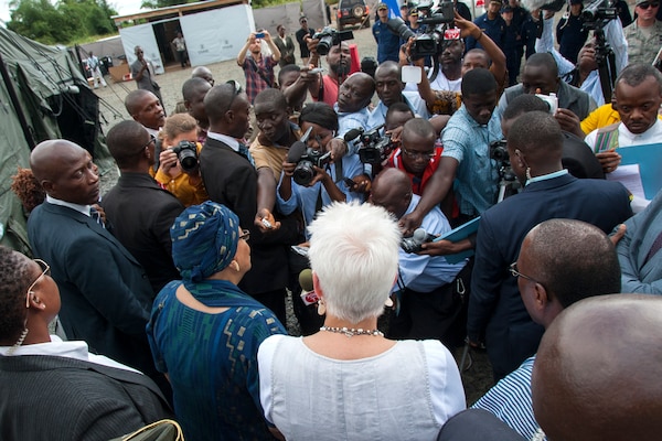 U.S. Ambassador to Liberia Deborah Malac, in white, and president of Liberia Ellen Johnson Sirleaf, left, speak to reporters after touring Ebola treatment unit built to care for medical workers who become infected while treating Ebola patients, in Harbel, Liberia, November 5, 2014 (U.S. Army/Nathan Hoskins)