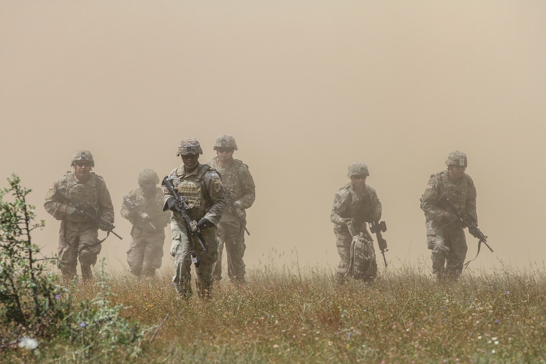 Cavalry scouts with 1st Battalion, 16th Infantry Regiment, 1st Armored Brigade Combat Team, 1st Infantry Division, maneuver toward cover after air assault during exercise Platinum Lion 19, at Novo Selo Training Area, Bulgaria, July 9, 2019 (U.S. Army/True Thao)