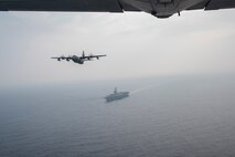 A U.S. Air Force MC-130J soars over the U.S.S. Ronald Reagan off the Northern Coast of Japan, Aug. 5, 2020, during Exercise Gryphon Jet 10. Gryphon Jet is an integrated training exercise focused on improving interoperability throughout the special operations community. During this exercise formation departure, ship based air traffic control procedures, night vision goggle mountain low level, air intercepts with F/A-18s and tilt-rotor air-to-air refueling with the CV-22 were simulated. (U.S. Air Force photo by Airman 1st Class China M. Shock)
