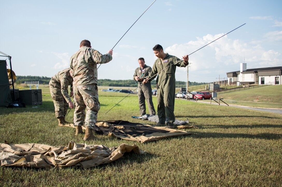 A photo of Airmen setting up equipment
