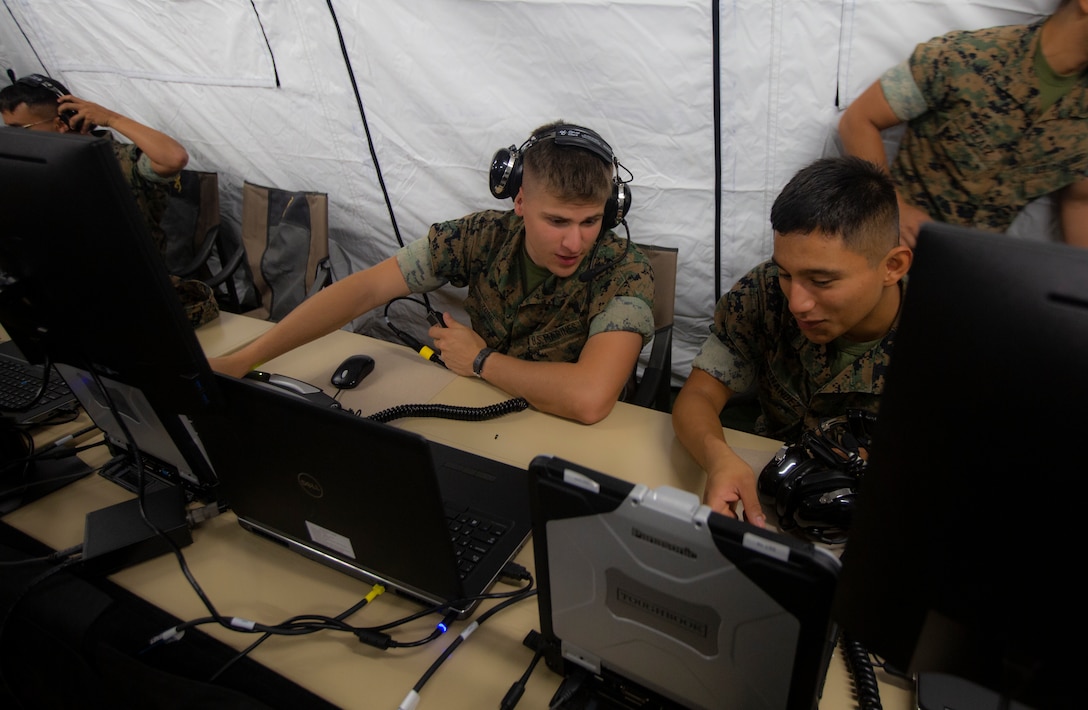 U.S. Marines conduct New Equipment Training with Phase II of the Common Aviation Command and Control System while aboard Marine Corps Air Station Futenma, Okinawa, Japan, Sept. 19.