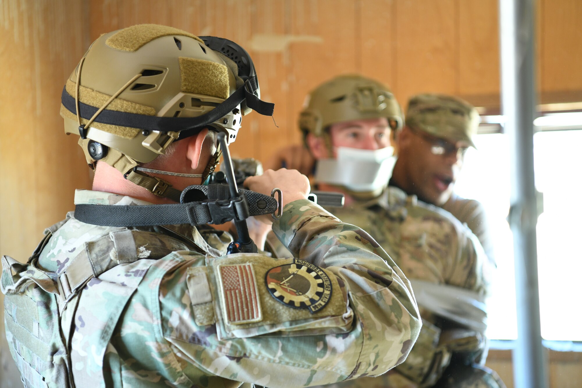 Airmen training with weapons