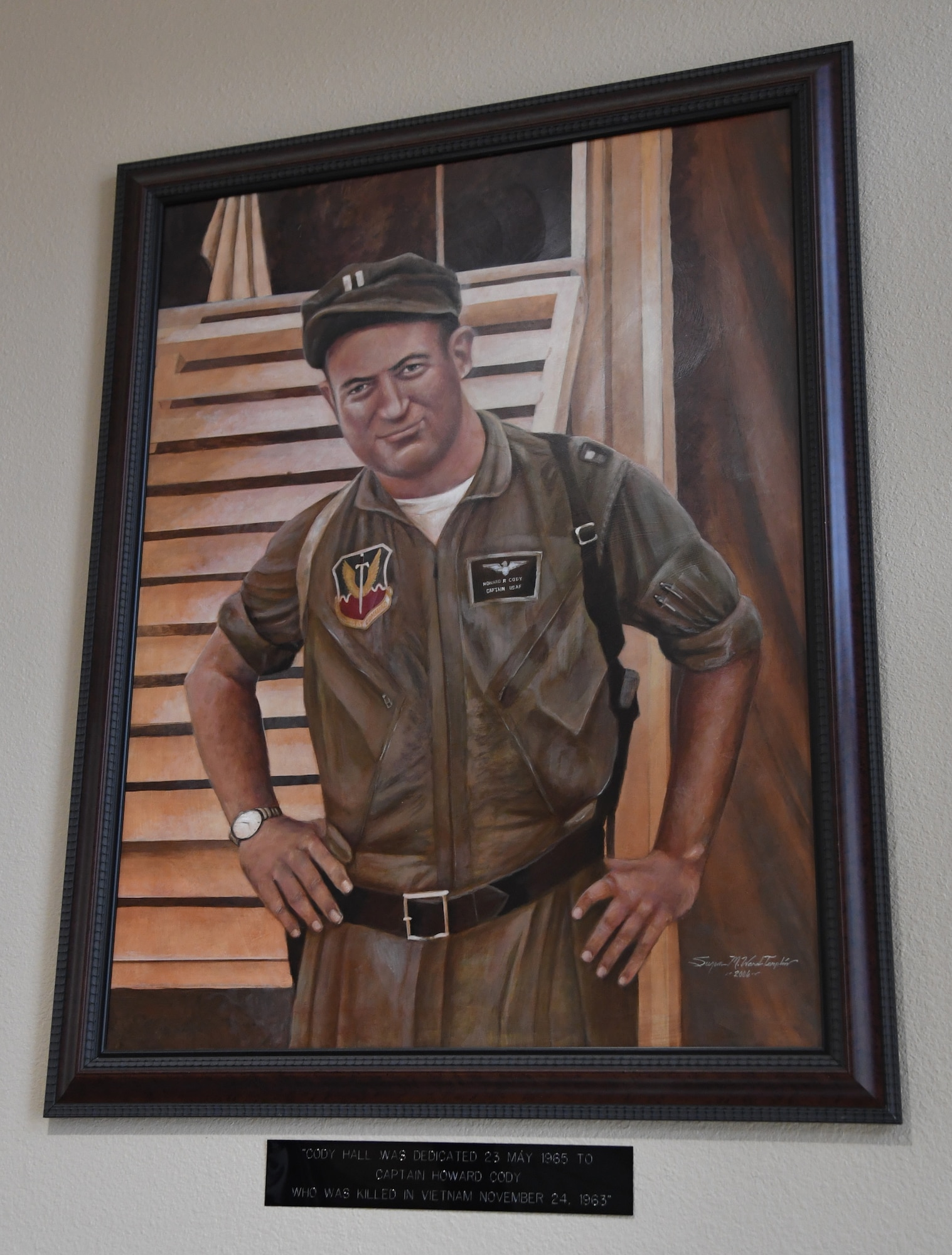 A painting of U.S. Air Force Capt. Howard Cody is on display inside Cody Hall at Keesler Air Force Base, Mississippi, Sept. 2, 2020. Cody was a senior pilot who was killed in action in South Vietnam in 1963. (U.S. Air Force photo by Kemberly Groue)