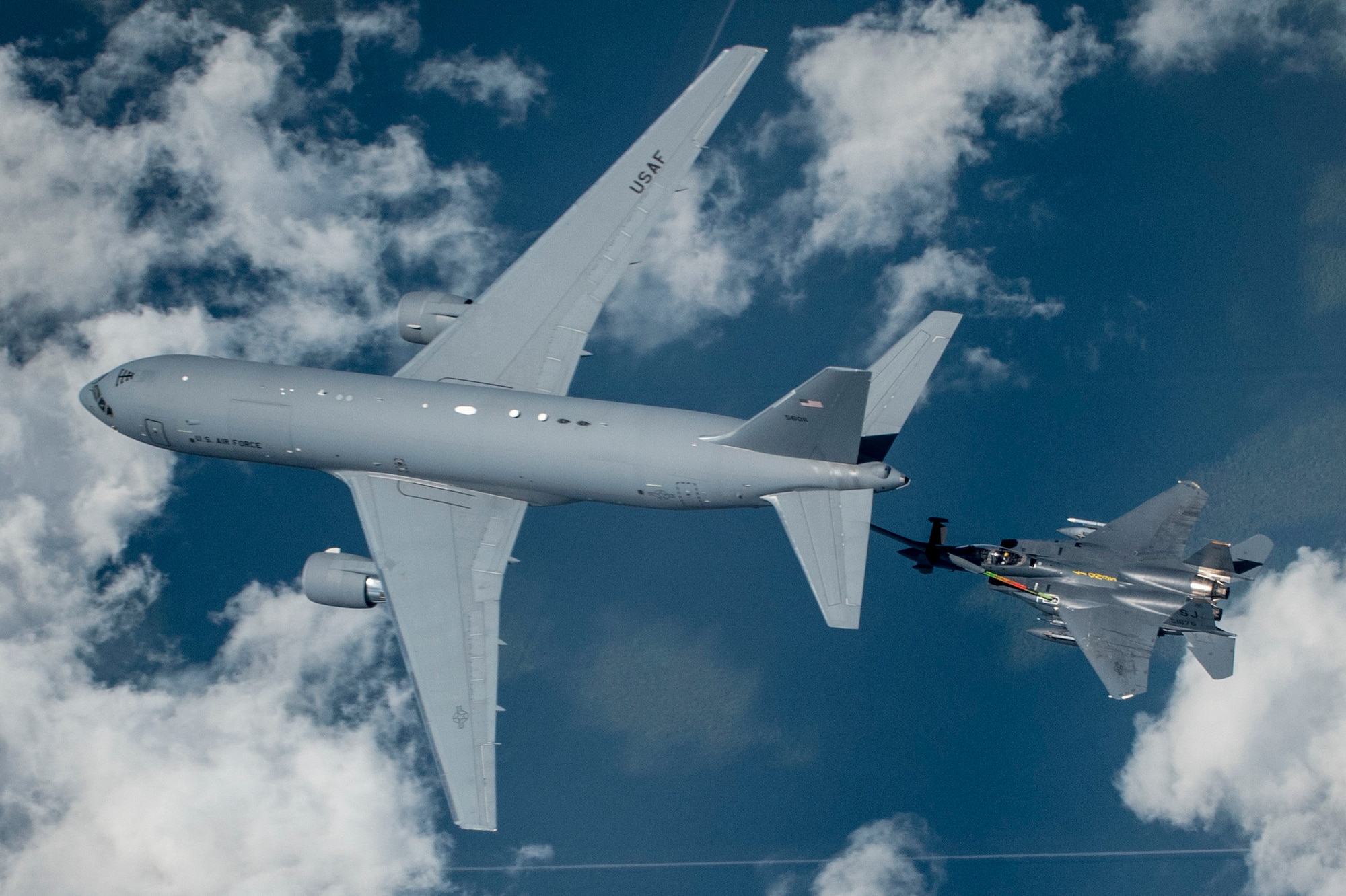 A KC-46 Pegasus from the 916th Air Refueling Wing in-air refuels an F-15E Strike Eagle from the 336th Fighter Squadron at Seymour Johnson Air Force Base over North Carolina.