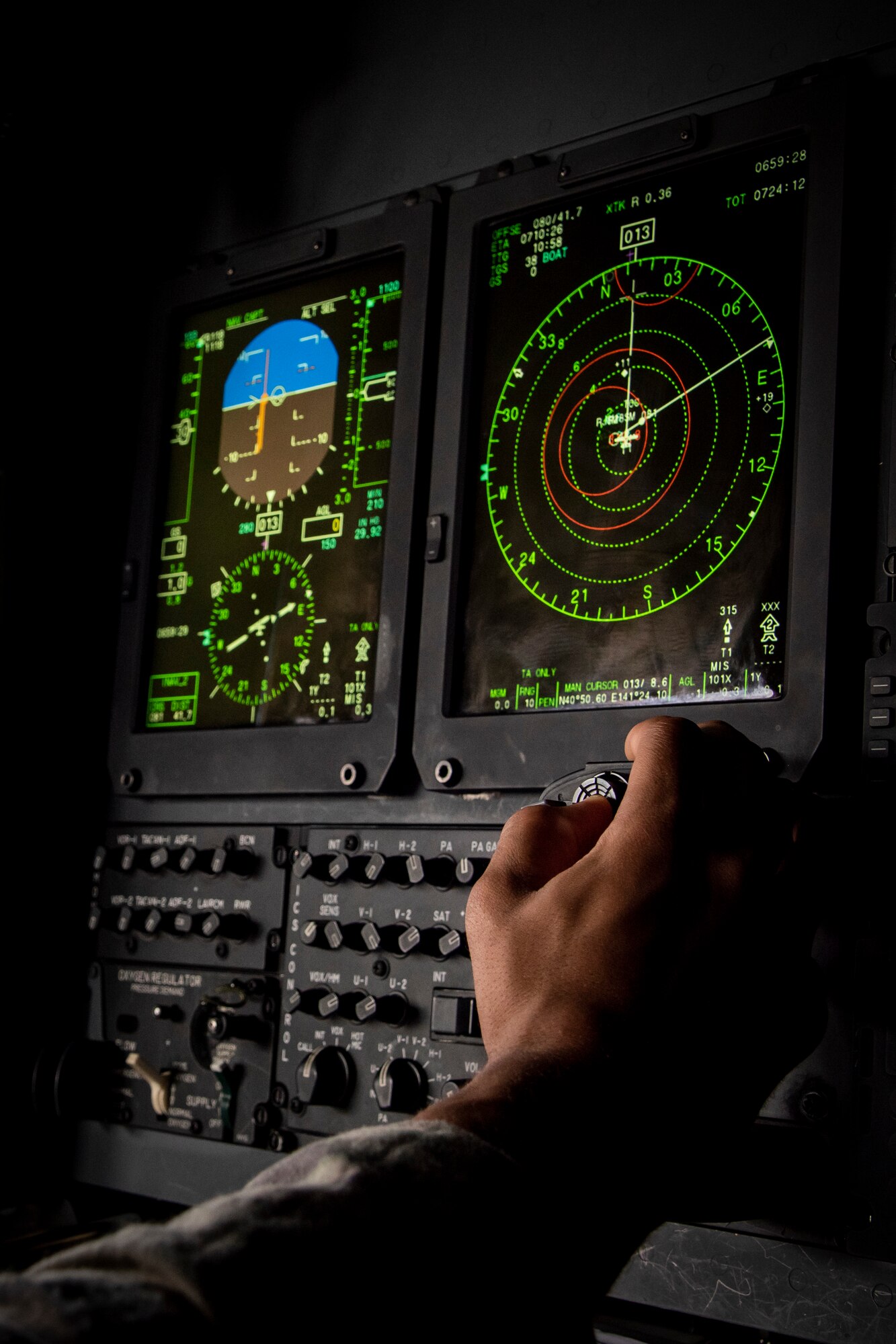A combat systems officer assigned to the 1st Special Operations Squadron navigates off the Northern Coast of Japan, Aug. 5, 2020, during Exercise Gryphon Jet 10. Gryphon Jet is an integrated training exercise focused on improving interoperability throughout the special operations community. During this exercise formation departure, ship based air traffic control procedures, night vision goggle mountain low level, air intercepts with F/A-18s and tilt-rotor air-to-air refueling with the CV-22 were simulated. (U.S. Air Force photo by Airman 1st Class China M. Shock)