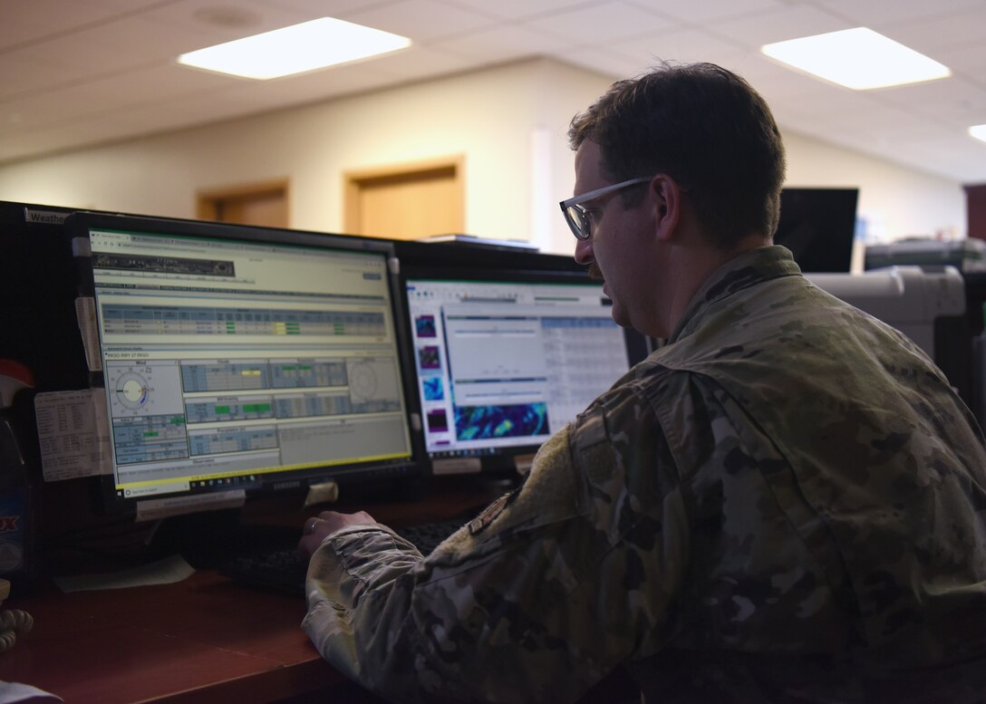 Staff Sgt. Kevin Waters, 51st Operations Support Squadron weather craftsman, observes live data of sensor information and model forecast products on Osan Air Base, Republic of Korea, September 10, 2020. During typhoon season on the Korean peninsula, members of the weather flight work together to gather accurate data to inform commanders, aircrew, and base agencies on expected and impending weather conditions that can cause life threatening damage or the destruction of private and government property. (U.S. Air force photo by Senior Airman Denise Jenson)