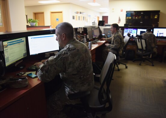 Master Sgt. Daniel Murphy, 51st Operations Support Squadron weather flight chief (front) and Staff Sgt. Kevin Waters, 51st OSS weather craftsman (center), observe live data of sensor information and model forecast products on Osan Air Base, Republic of Korea, September 10, 2020. During typhoon season on the Korean peninsula, members of the weather flight work together to gather accurate data to inform commanders, aircrew, and base agencies on expected and impending weather conditions that can cause life threatening damage or the destruction of private and government property. (U.S. Air force photo by Senior Airman Denise Jenson)