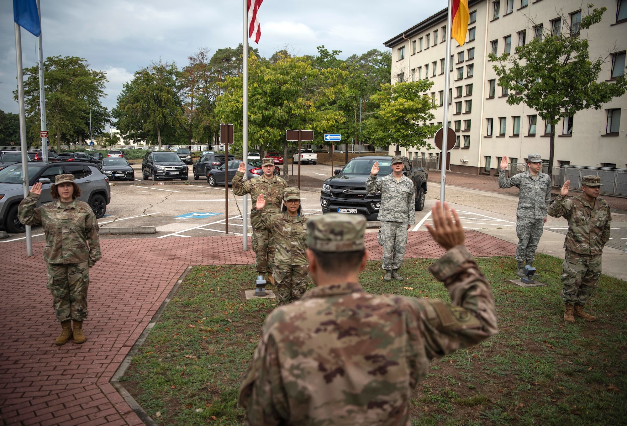 U.S. Space Force Col. James Quinn, U.S. Air Forces in Europe space forces director, gives the Oath of Enlistment to a group of U.S. Airmen at a U.S. Space Force transfer ceremony.